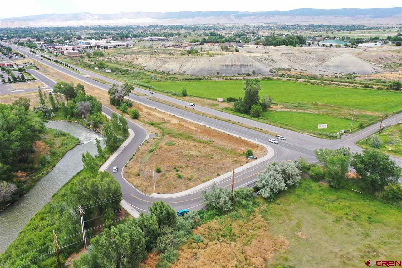 Tbd South Highway 550 & Otter Road Montrose, CO 81401 - Photo 7 of 30 an aerial view of a house with a yard and lake view