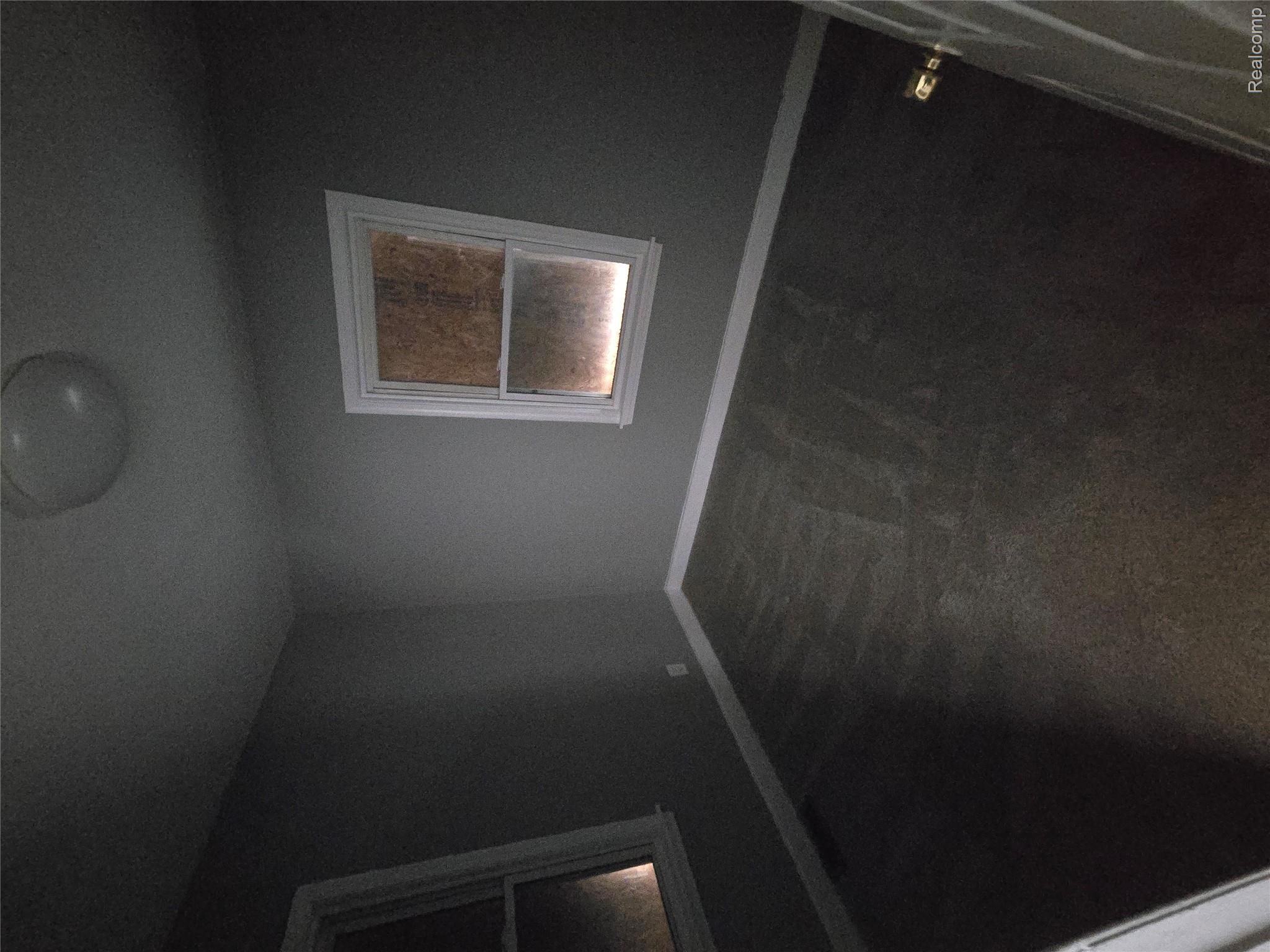 18119 Cornwall Street Detroit, MI 48224 - Photo 13 of 18 Spare room with baseboards and dark carpet