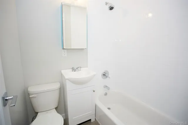 a bathroom with a sink toilet and bathtub