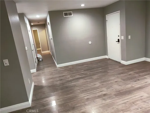 wooden floor in a hall with an entryway