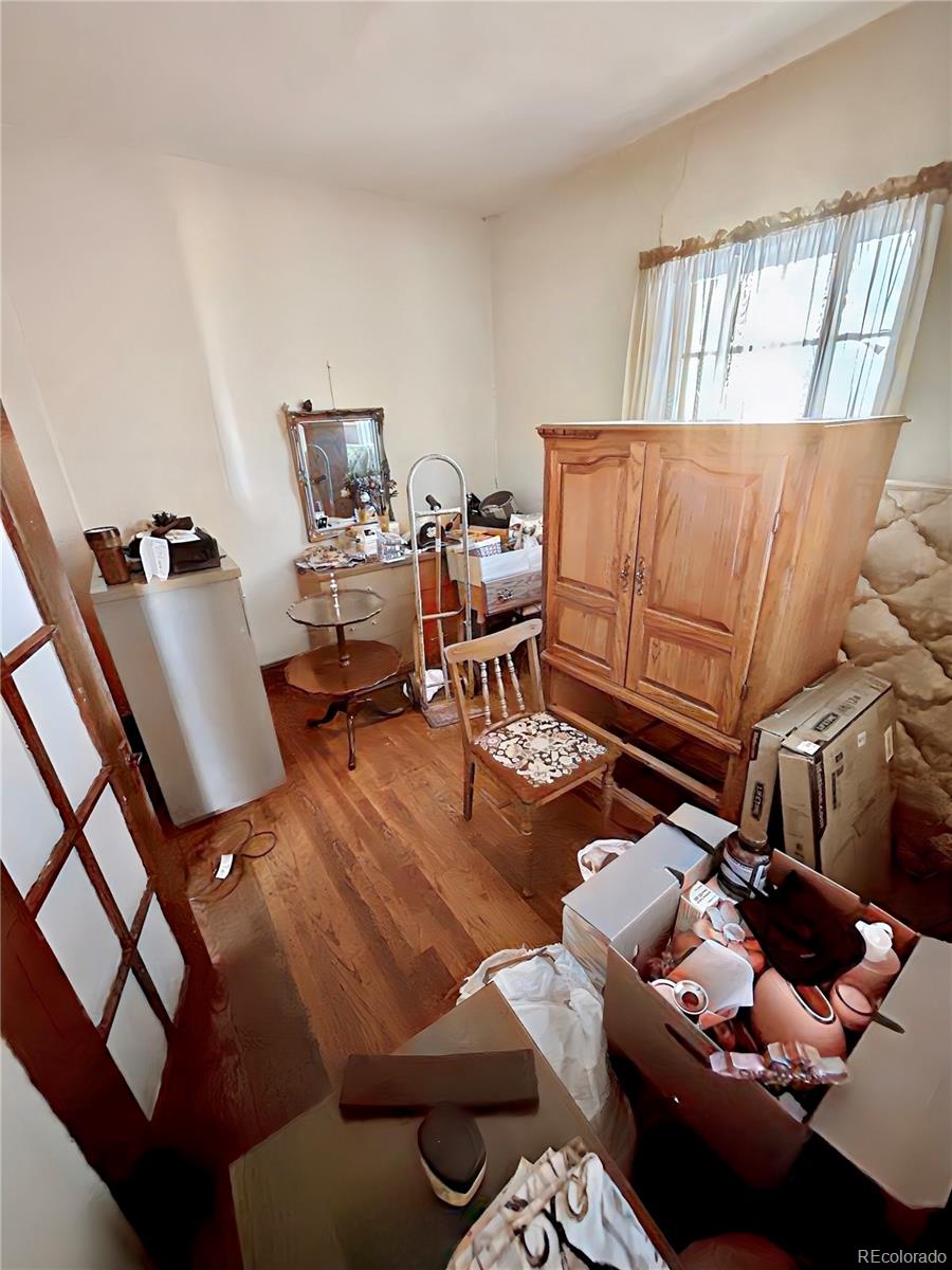 3935 Shoshone Street Denver, CO 80211 - Photo 10 of 14 a living room with furniture and a window