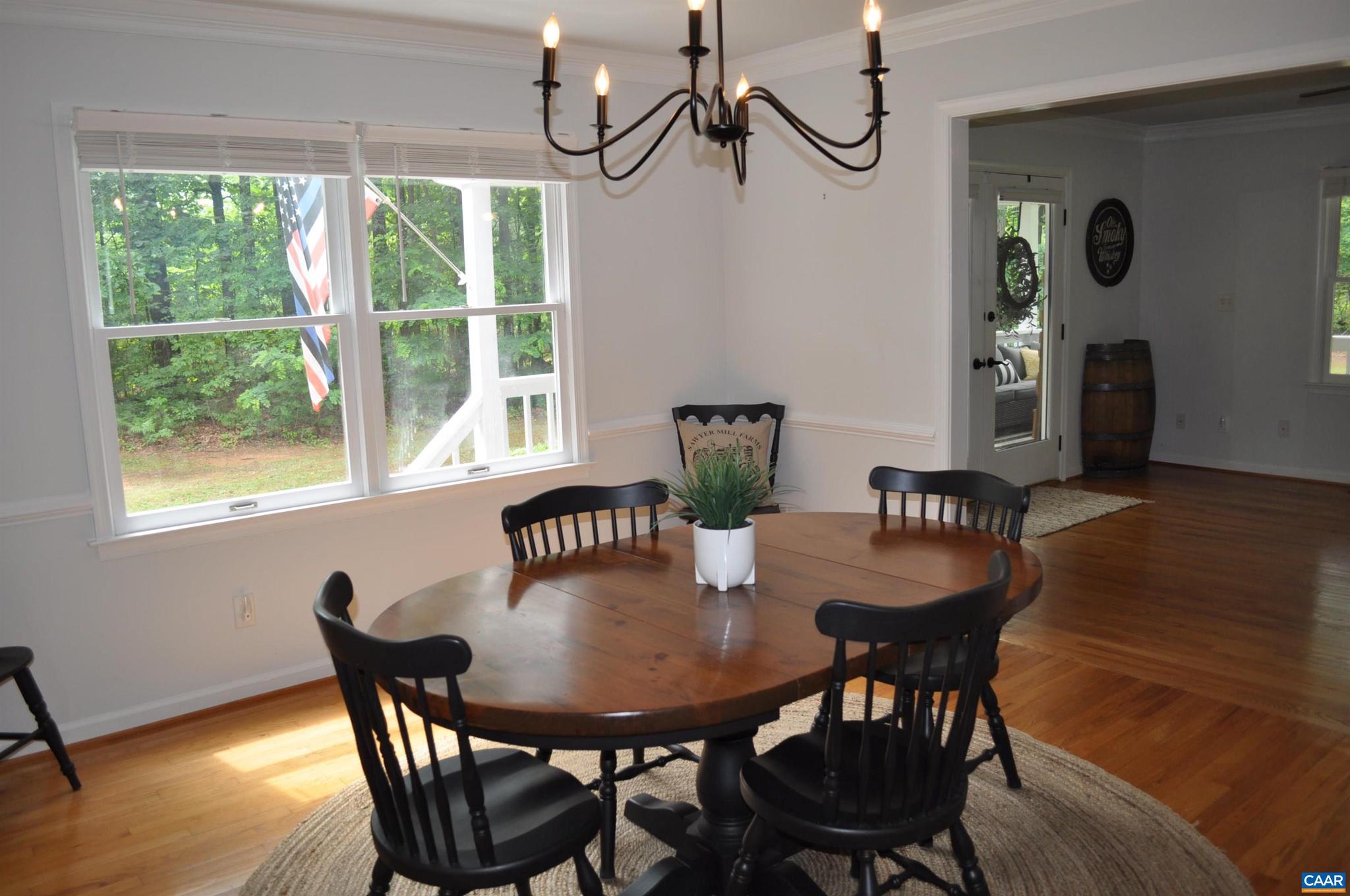 3257 Martin Kings Road Charlottesville, VA 22902 - Photo 11 of 49 a view of a dining room with furniture window and wooden floor