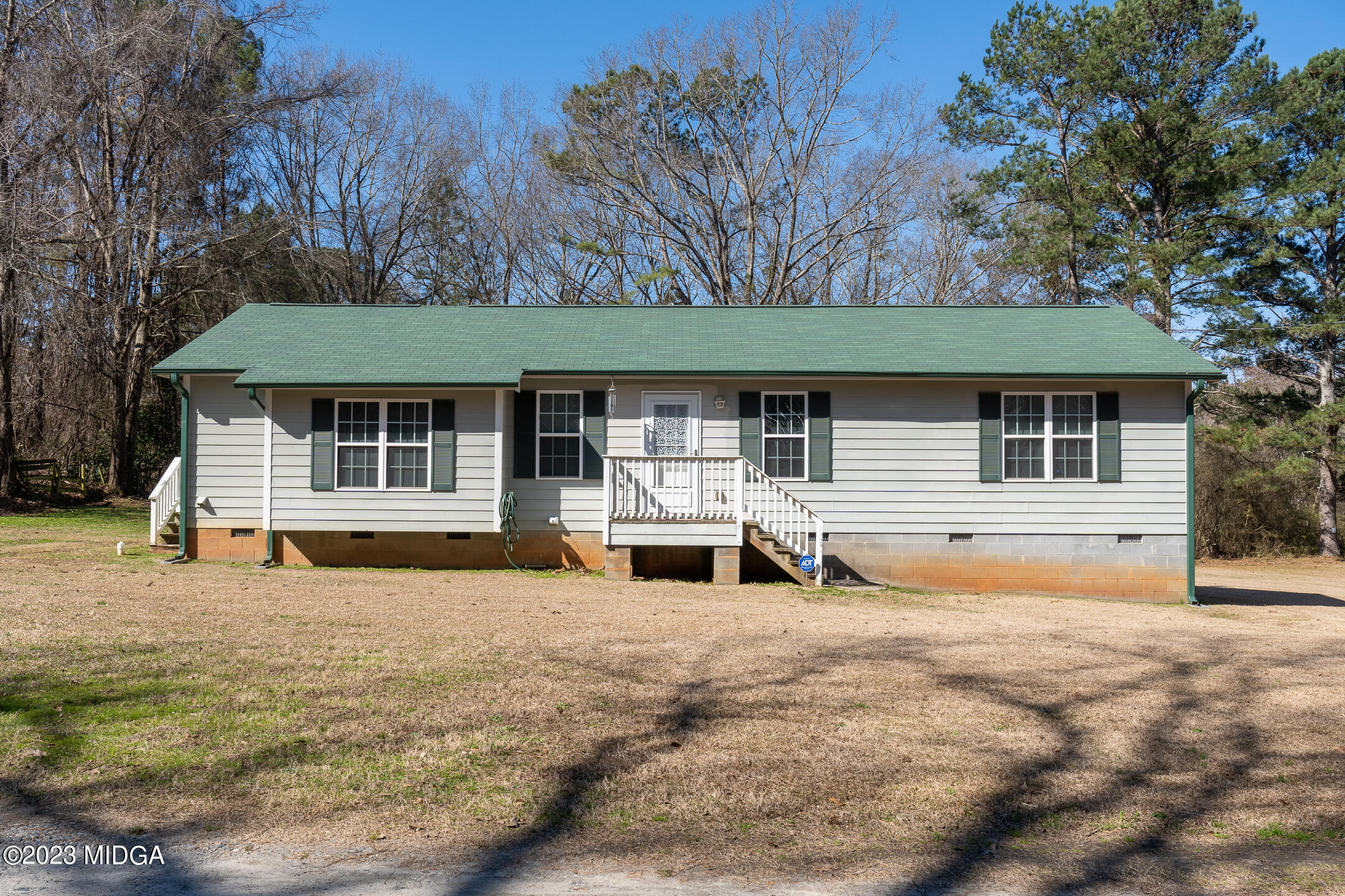 128 Samuel Barber Road Jackson, GA 30233 - Photo 1 of 27 a front view of a house with a yard