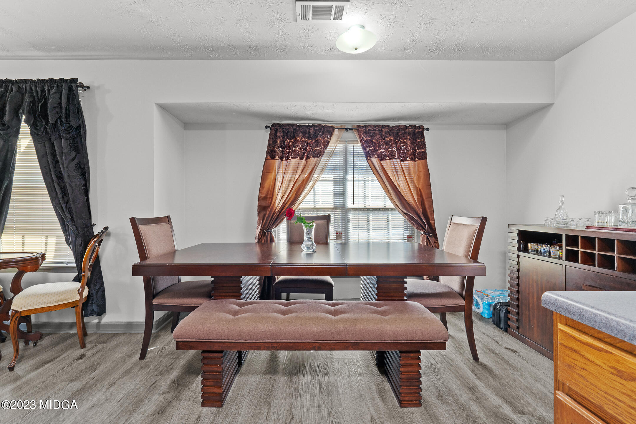 128 Samuel Barber Road Jackson, GA 30233 - Photo 11 of 27 a view of a dining room with furniture window and wooden floor