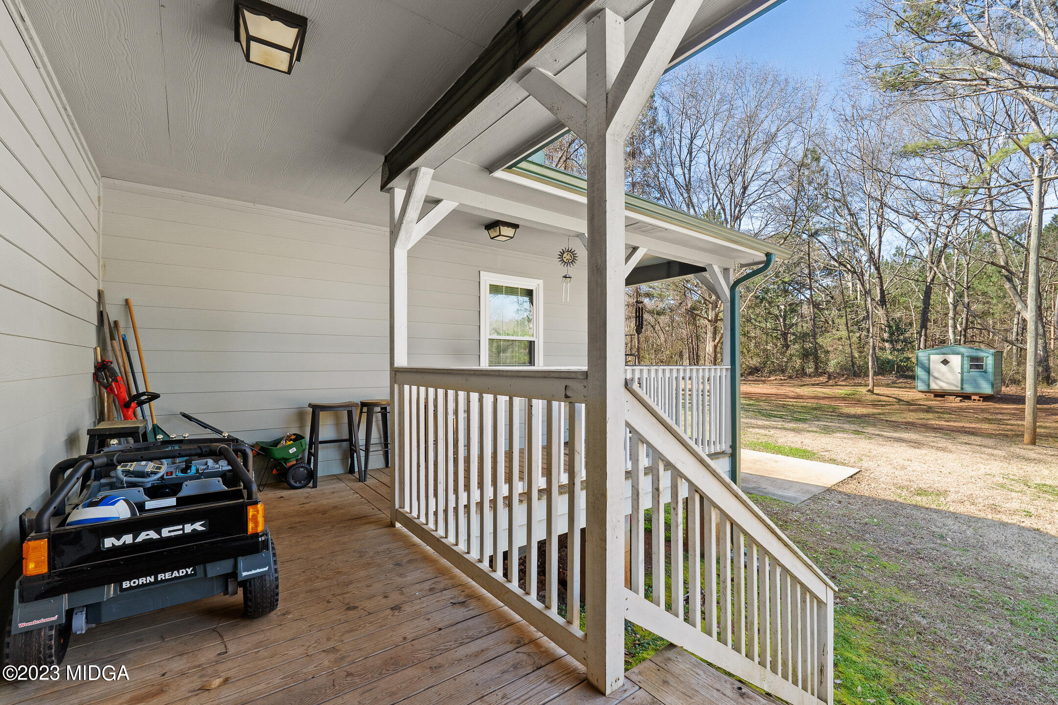 128 Samuel Barber Road Jackson, GA 30233 - Photo 20 of 27 a view of a balcony with car parked
