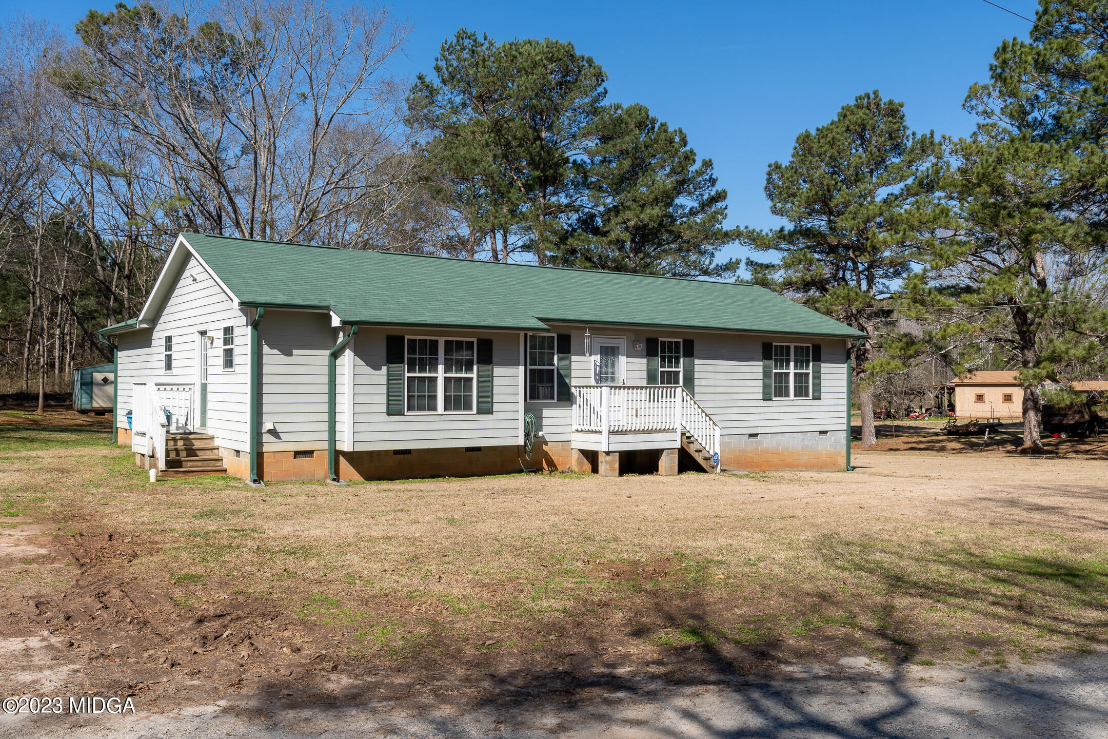 128 Samuel Barber Road Jackson, GA 30233 - Photo 2 of 27 a front view of a house with a yard