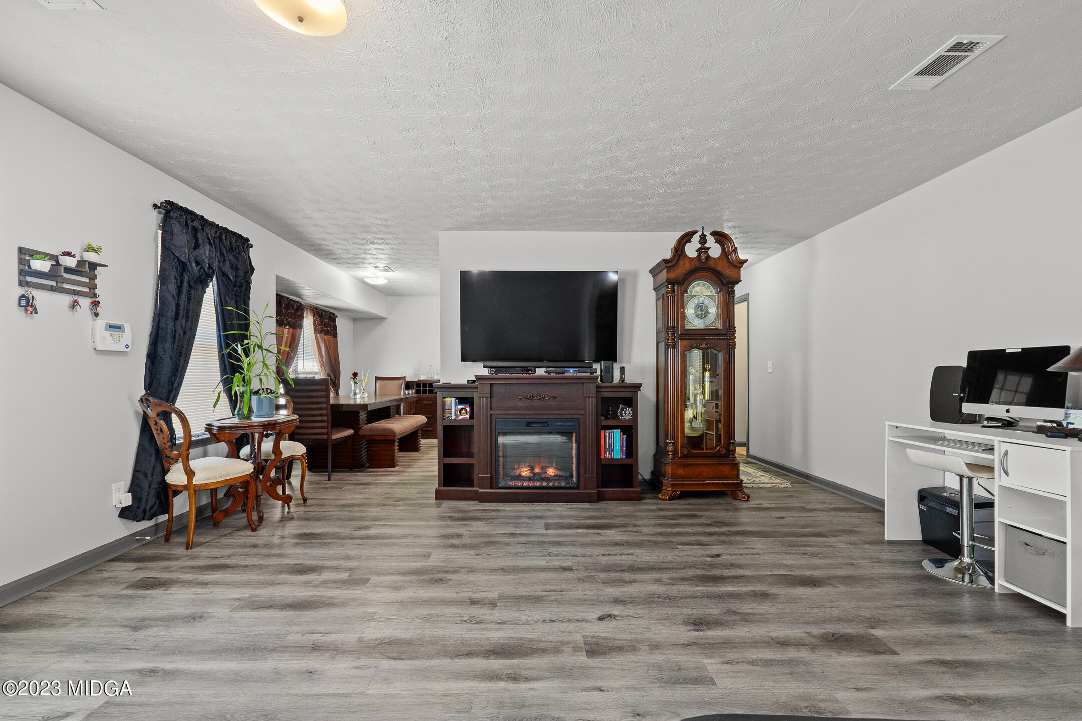 128 Samuel Barber Road Jackson, GA 30233 - Photo 25 of 27 a living room with furniture and a flat screen tv