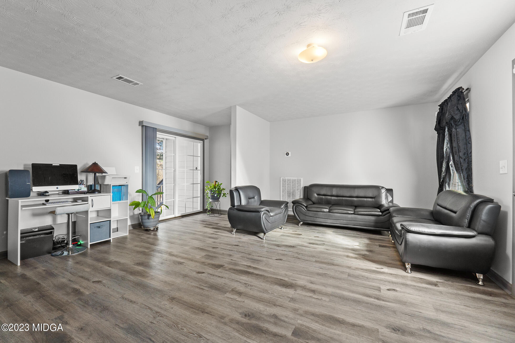 128 Samuel Barber Road Jackson, GA 30233 - Photo 7 of 27 a living room with furniture and a flat screen tv