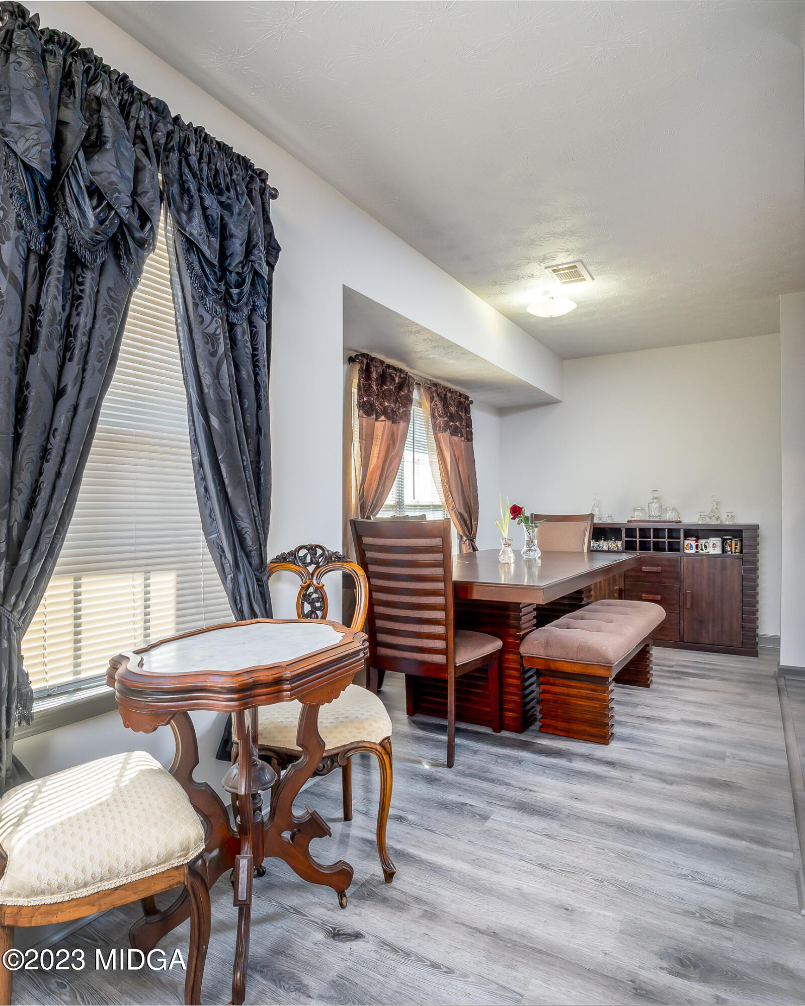 128 Samuel Barber Road Jackson, GA 30233 - Photo 9 of 27 a living room with furniture and a wooden floor