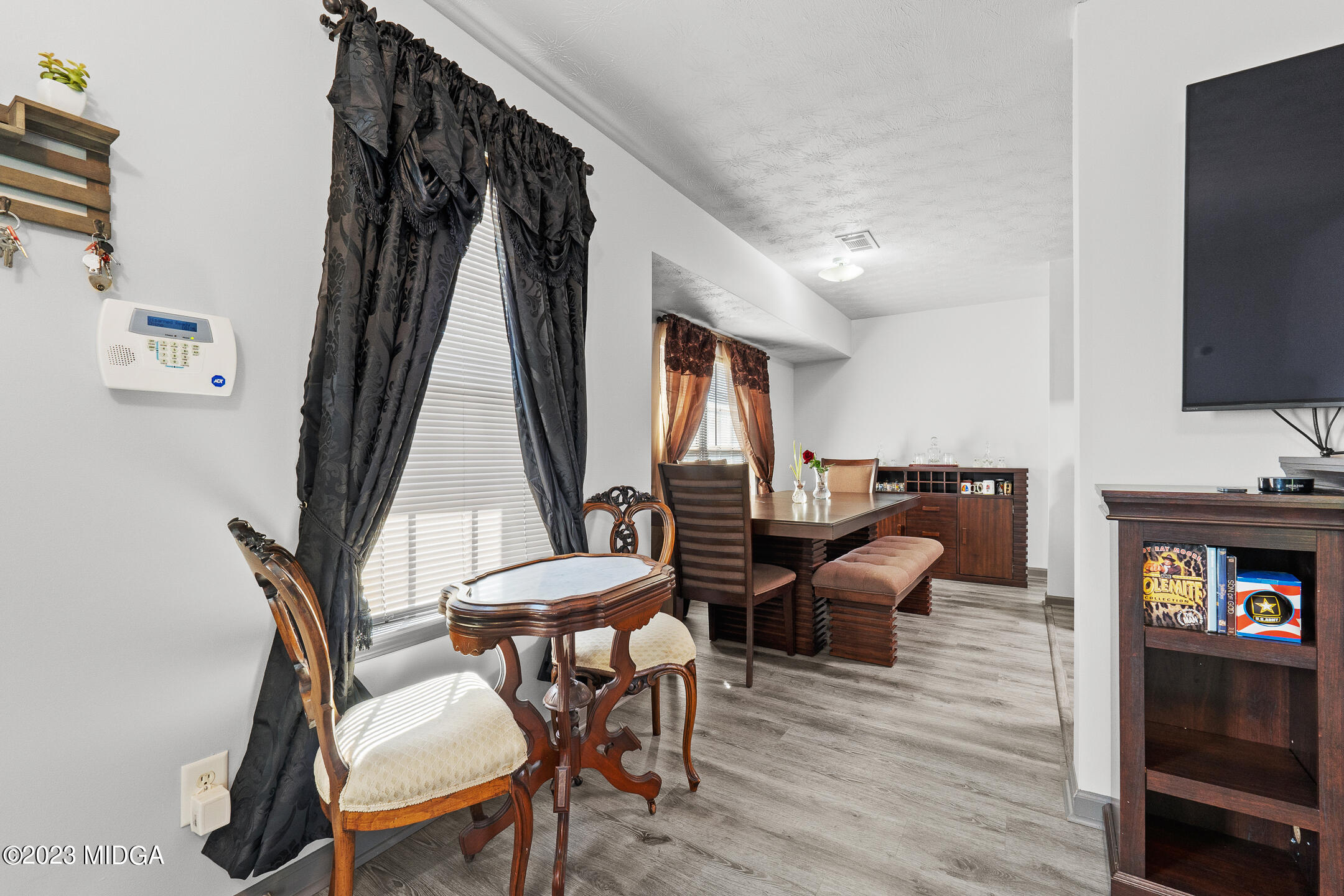 128 Samuel Barber Road Jackson, GA 30233 - Photo 10 of 27 a view of a livingroom with furniture window and wooden floor
