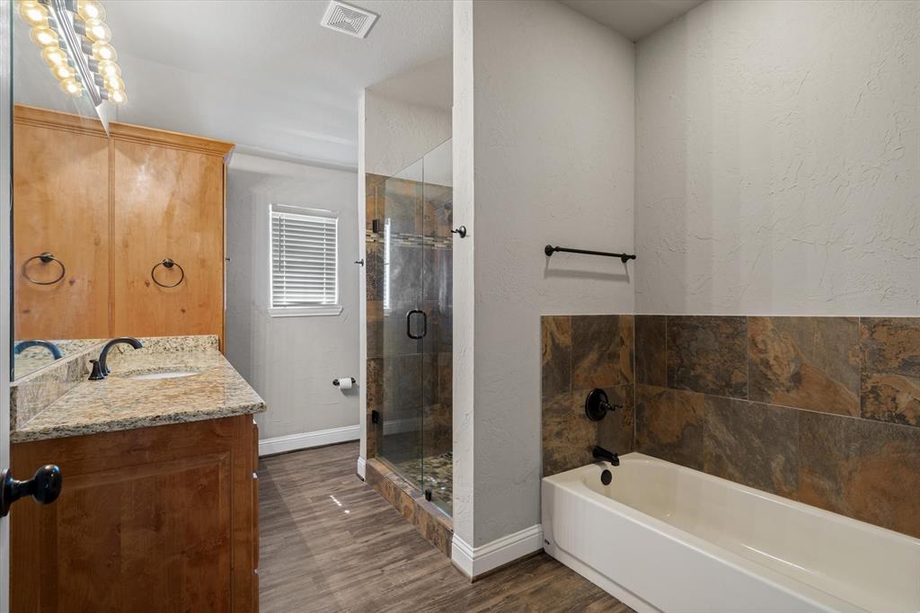 337 County Road 2719 Mabank, TX 75147 - Photo 11 of 19 a bathroom with a granite countertop tub sink and shower