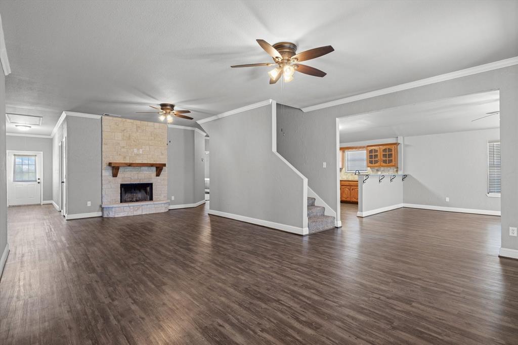 337 County Road 2719 Mabank, TX 75147 - Photo 3 of 19 a view of a livingroom with wooden floor and fireplace