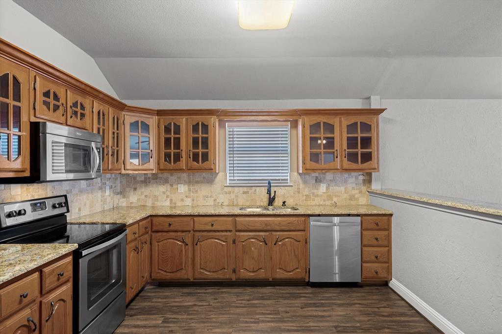 337 County Road 2719 Mabank, TX 75147 - Photo 4 of 19 a kitchen with stainless steel appliances granite countertop a sink and cabinets