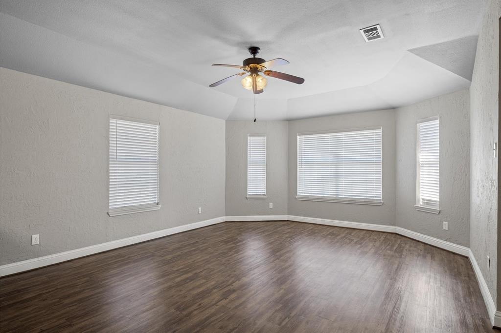 337 County Road 2719 Mabank, TX 75147 - Photo 6 of 19 a view of a livingroom with wooden floor and a ceiling fan