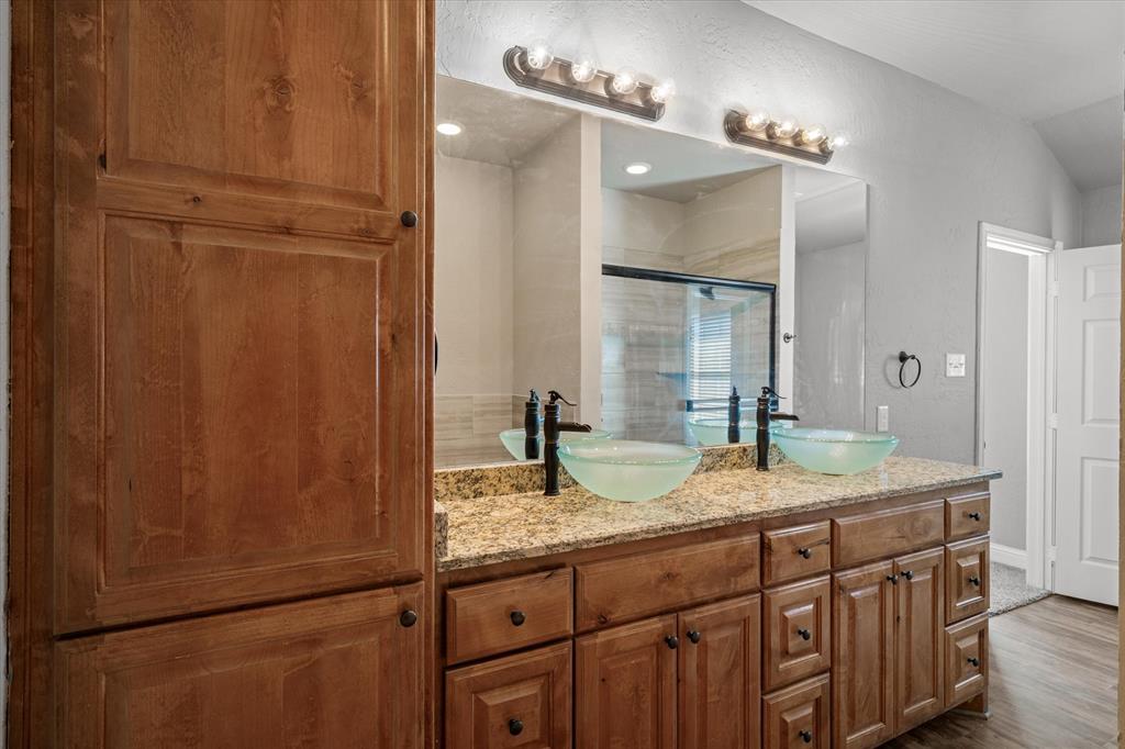 337 County Road 2719 Mabank, TX 75147 - Photo 9 of 19 a bathroom with a granite countertop sink and a mirror