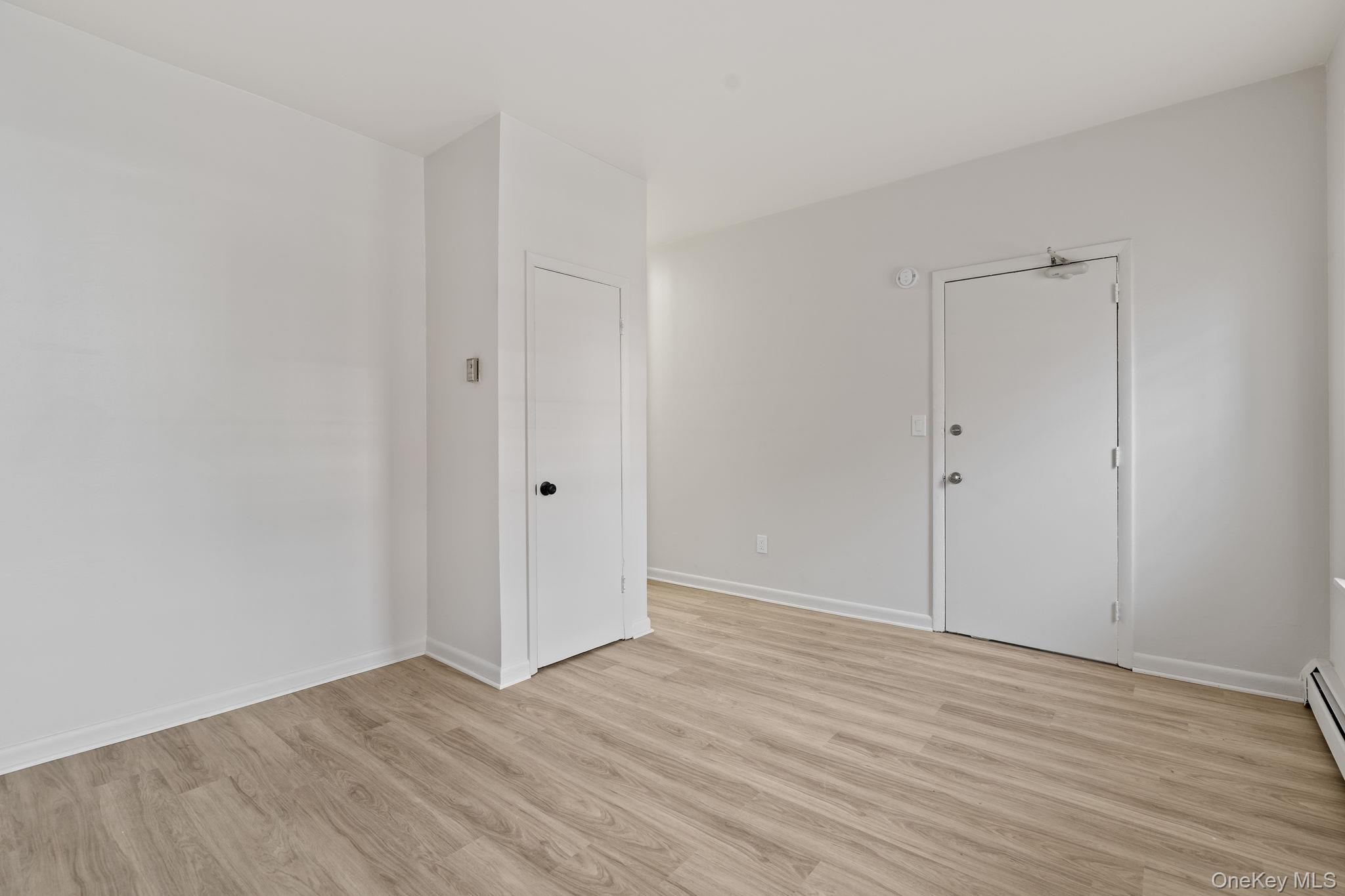 32 North Bridge Street Poughkeepsie, NY 12601 - Photo 6 of 19 a view of an empty room with wooden floor