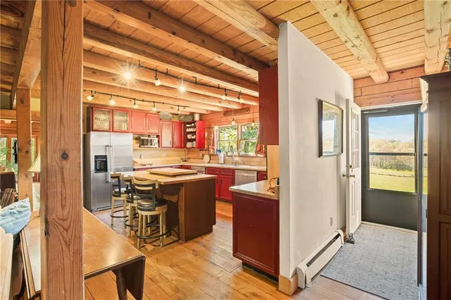 a bathroom with a toilet and a shower curtain