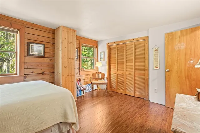 a spacious bathroom with a granite countertop sink mirror and a