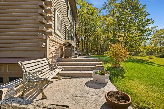 a front view of house with outdoor seating