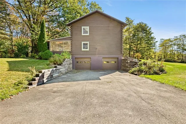 a house with garden in front of it