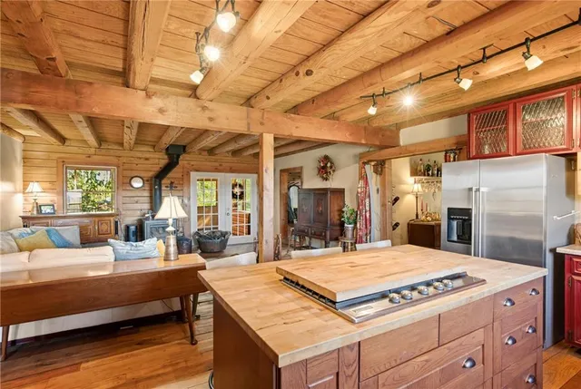 a view of a kitchen with dining table and chairs