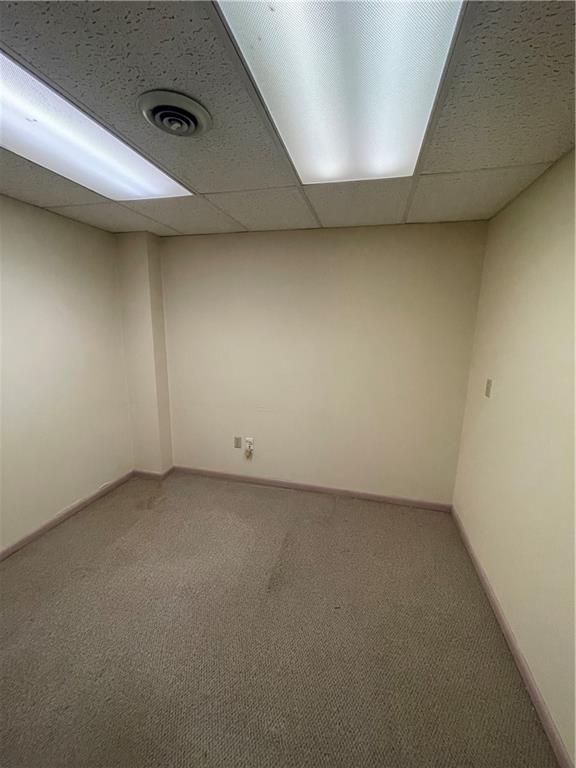 235 Longfellow Street Vandergrift, PA 15690 - Photo 3 of 6 an empty room with a workbench