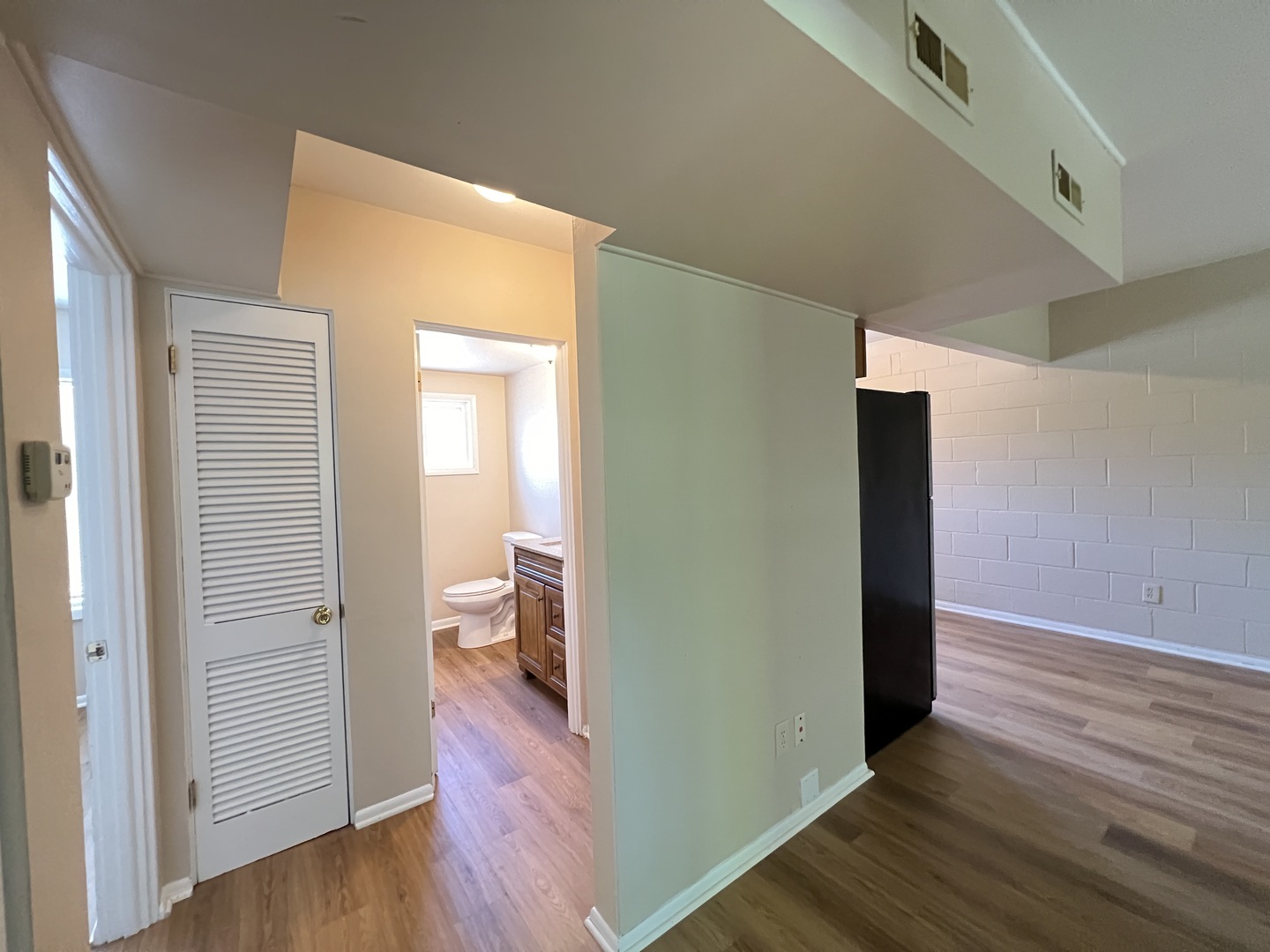 2900 Elizabeth Avenue, Unit 2S Zion, IL 60099 - Photo 11 of 12 a view of an empty room with wooden floor and a window