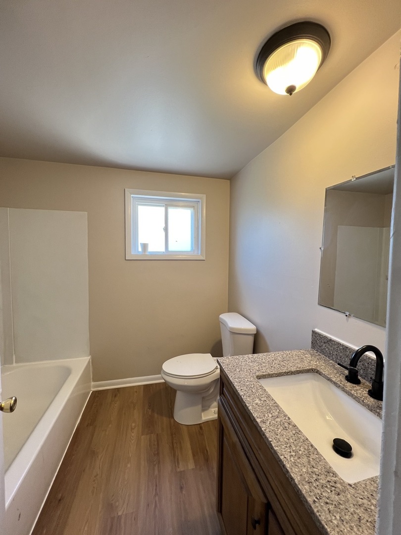 2900 Elizabeth Avenue, Unit 2S Zion, IL 60099 - Photo 6 of 12 a bathroom with a sink and a toilet