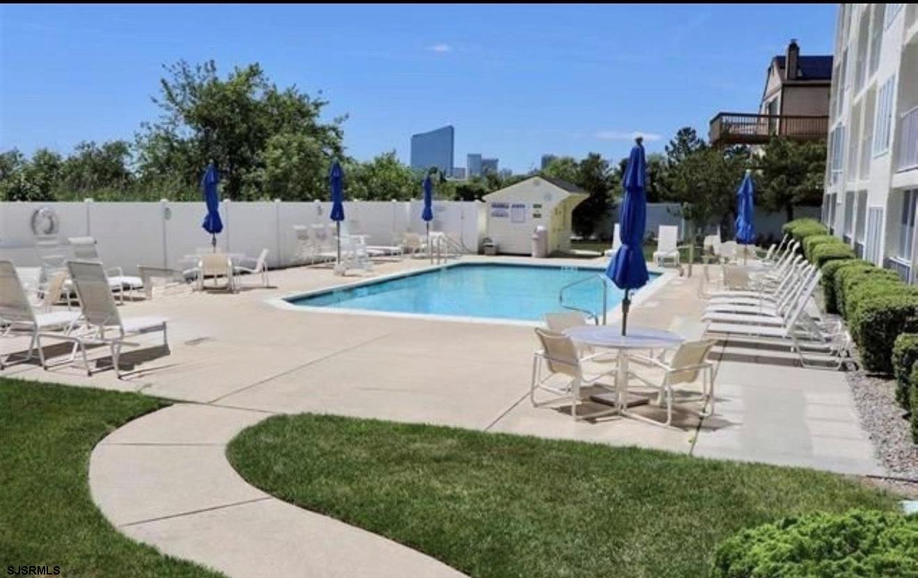 4600 West Brigantine Avenue, Unit 211 Brigantine, NJ 08203 - Photo 3 of 23 an outdoor space with patio and a garden