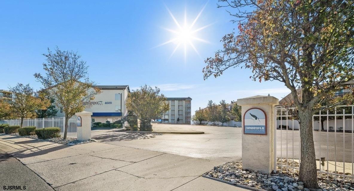 4600 West Brigantine Avenue, Unit 211 Brigantine, NJ 08203 - Photo 7 of 23 a outdoor view of a building with traffic signal lights