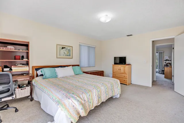 a bedroom with a bed and a walk in closet