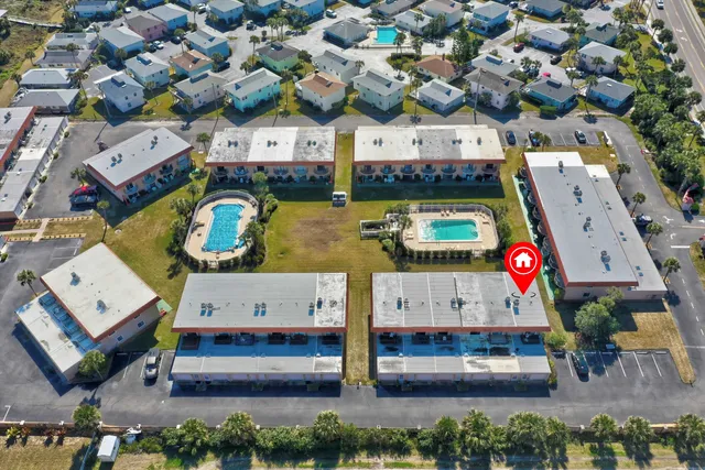 an aerial view of a building with outdoor space