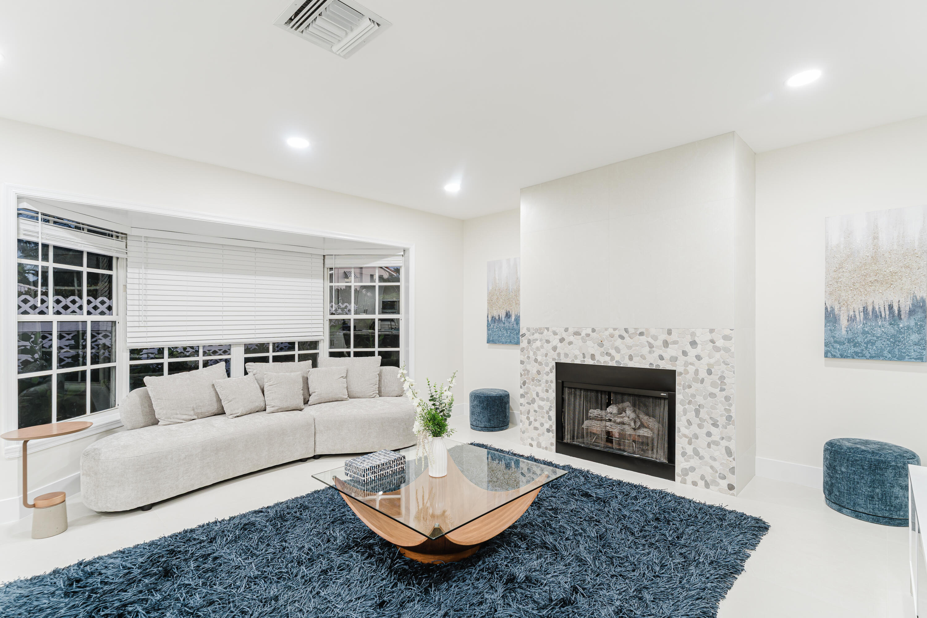 3199 Northeast 6th Drive Boca Raton, FL 33431 - Photo 18 of 49 a living room with furniture and a fireplace