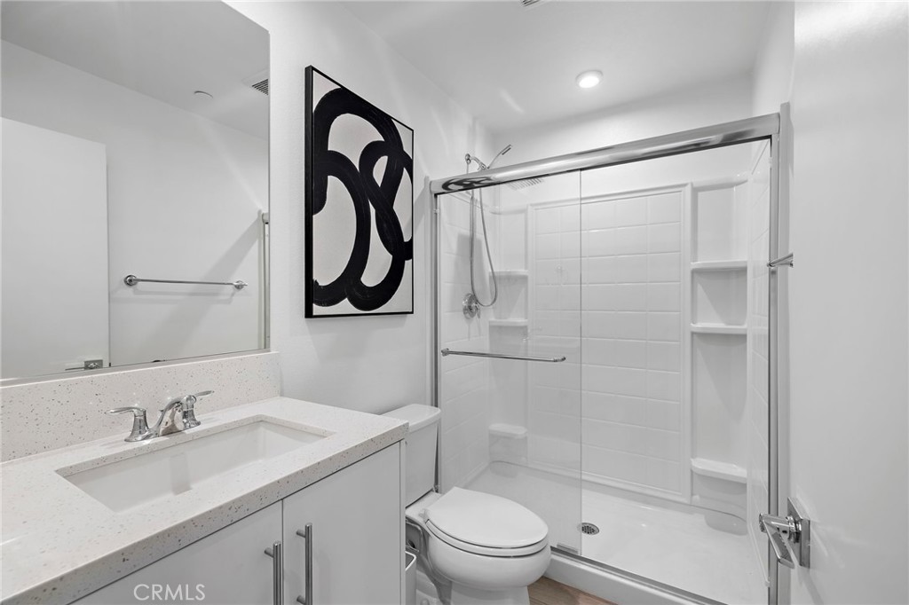 1826 West Bushell Street Anaheim, CA 92805 - Photo 17 of 30 a bathroom with a granite countertop sink toilet and shower