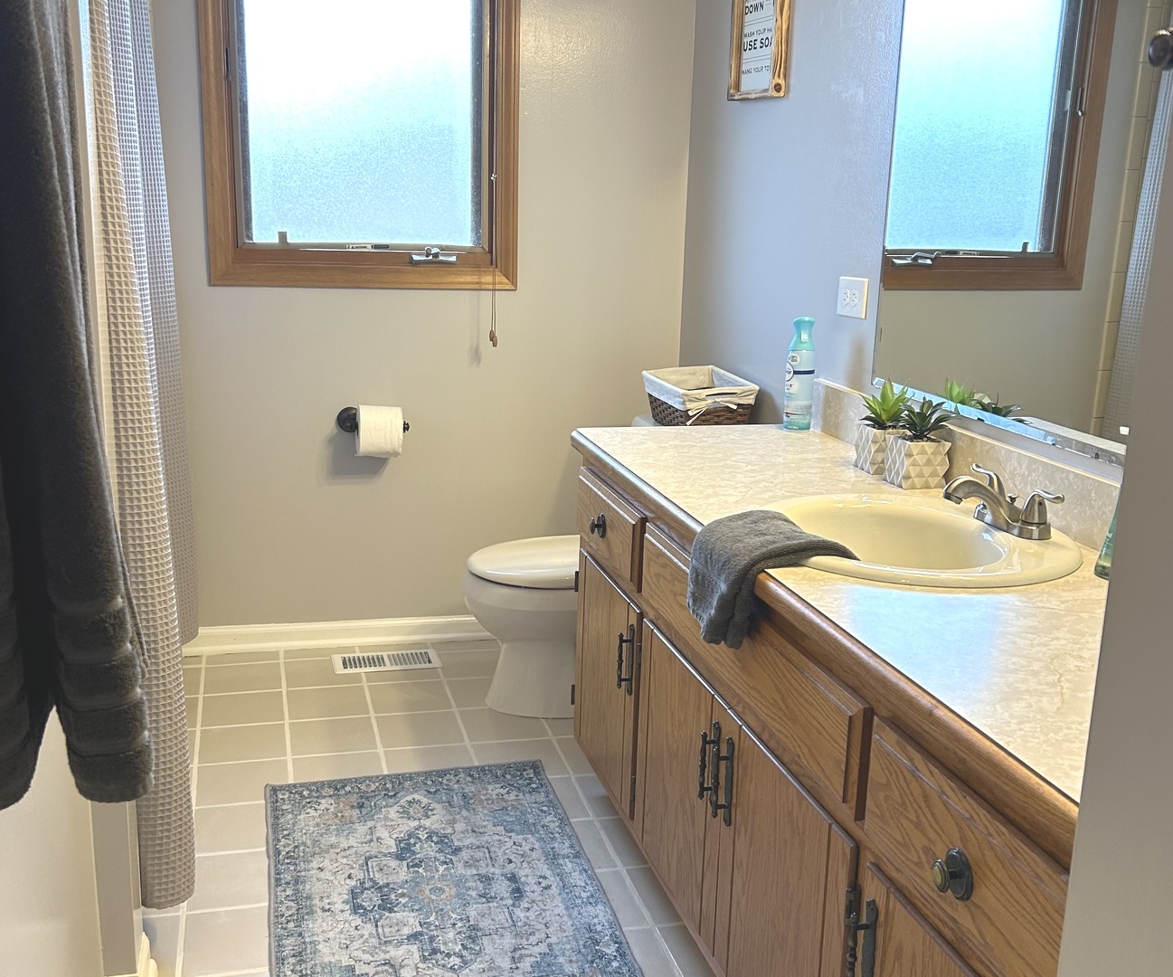 16454 Spangler Road Plainfield, IL 60586 - Photo 19 of 28 a bathroom with a sink toilet and mirror