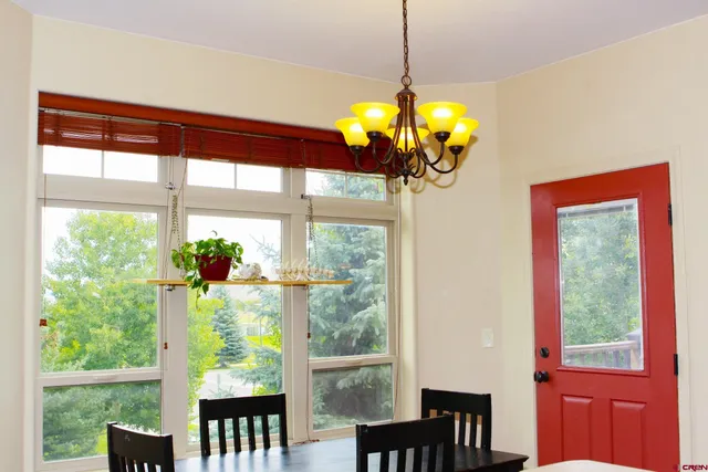 a view of a dining room with furniture window and outside view