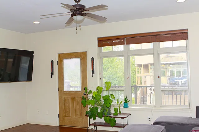 a view of an entryway with wooden floor