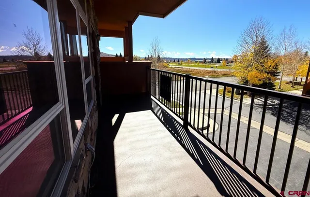 a view of balcony with wooden floor and outdoor space