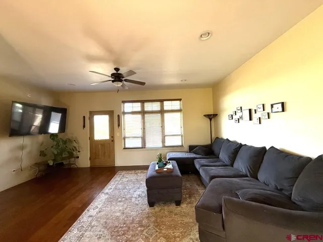 a living room with furniture and a window