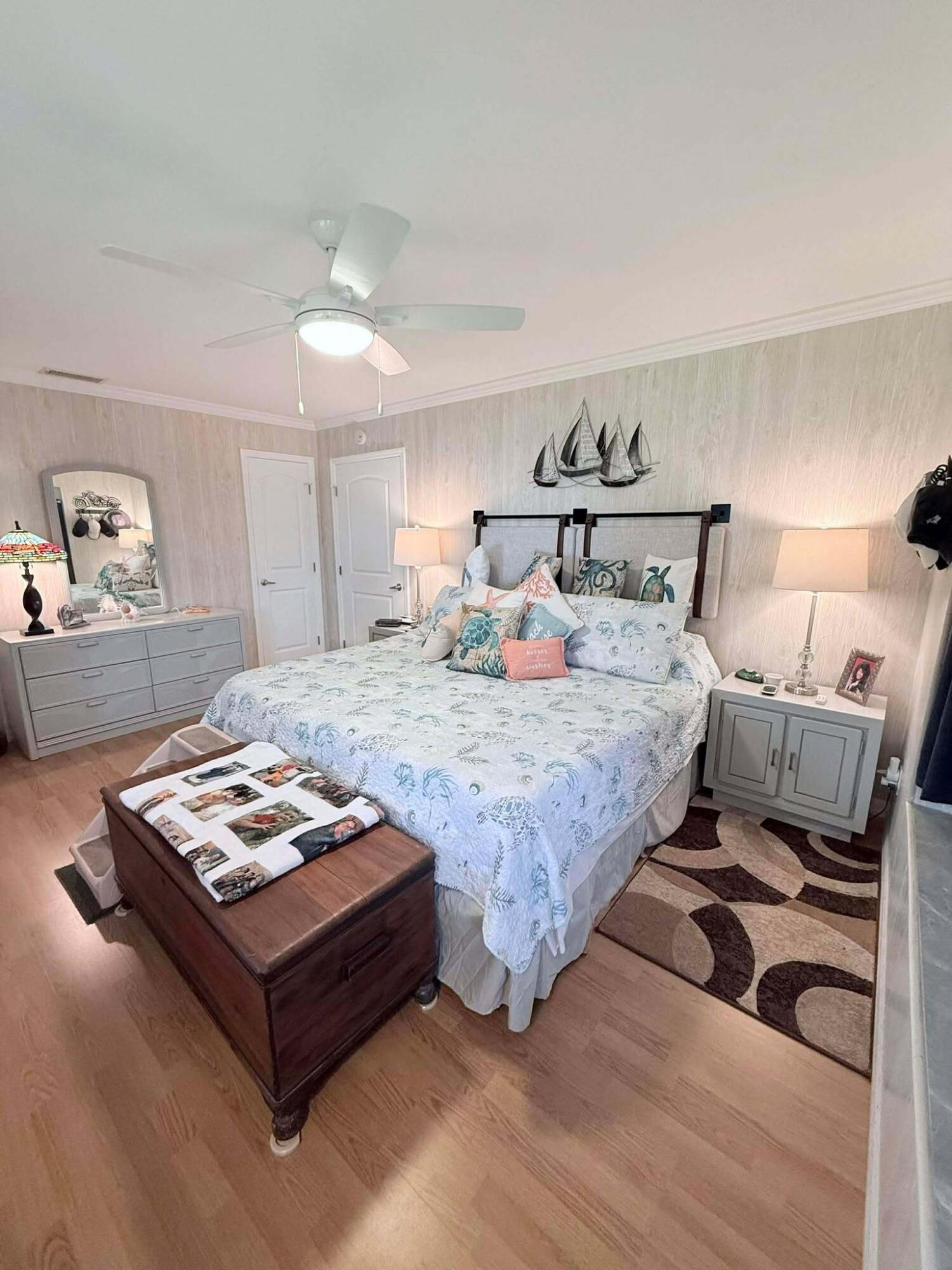 12321 Southeast 138th Avenue, Unit 216 Okeechobee, FL 34974 - Photo 11 of 34 a bedroom with a bed and window