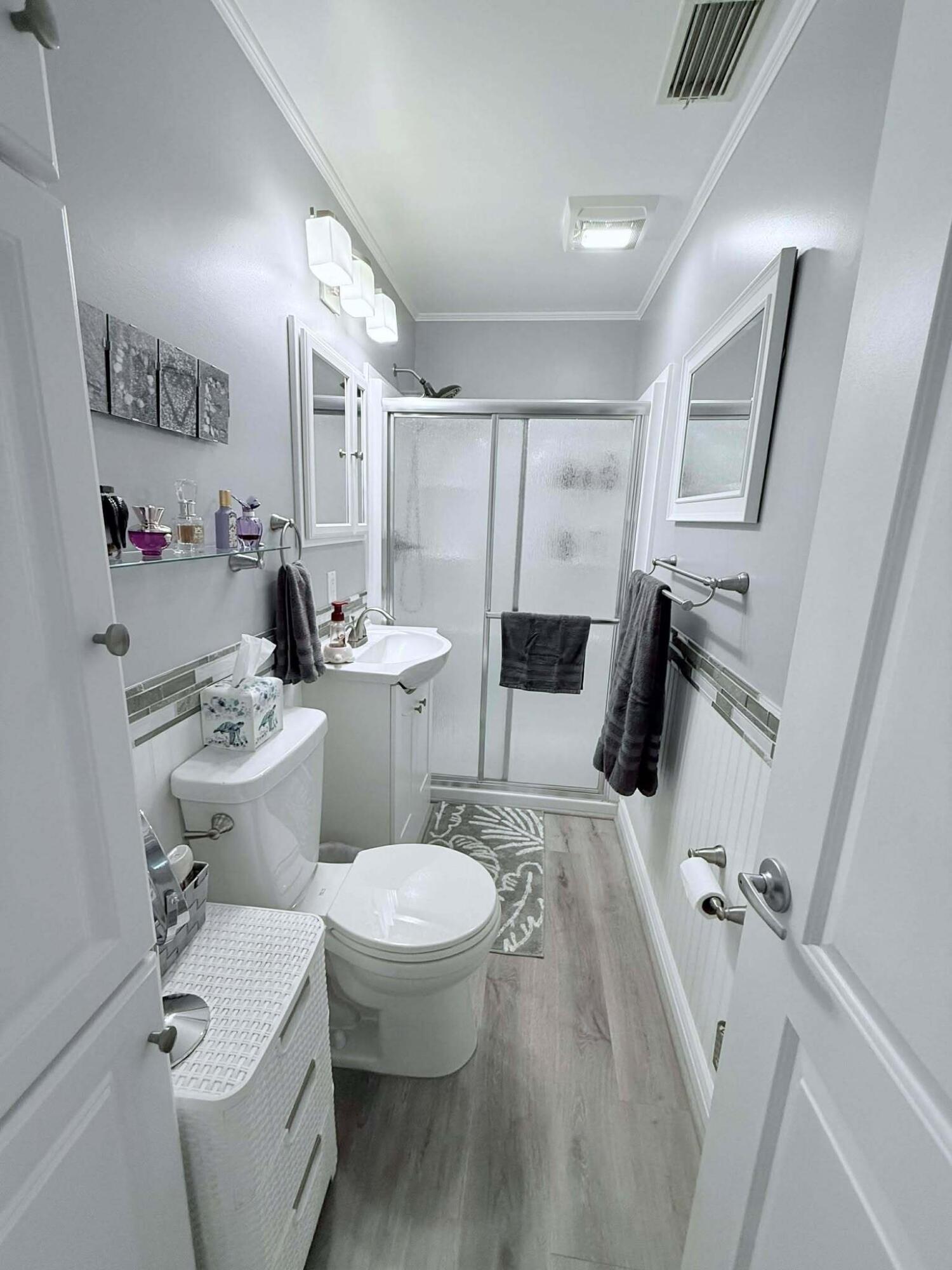 12321 Southeast 138th Avenue, Unit 216 Okeechobee, FL 34974 - Photo 14 of 34 a bathroom with a sink toilet and shower