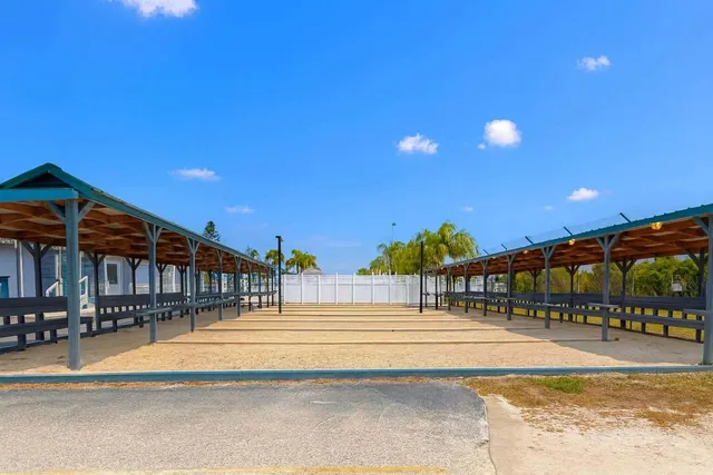 a view of swimming pool with outdoor seating and deck