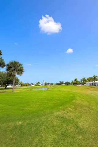 a view of an ocean and a yard