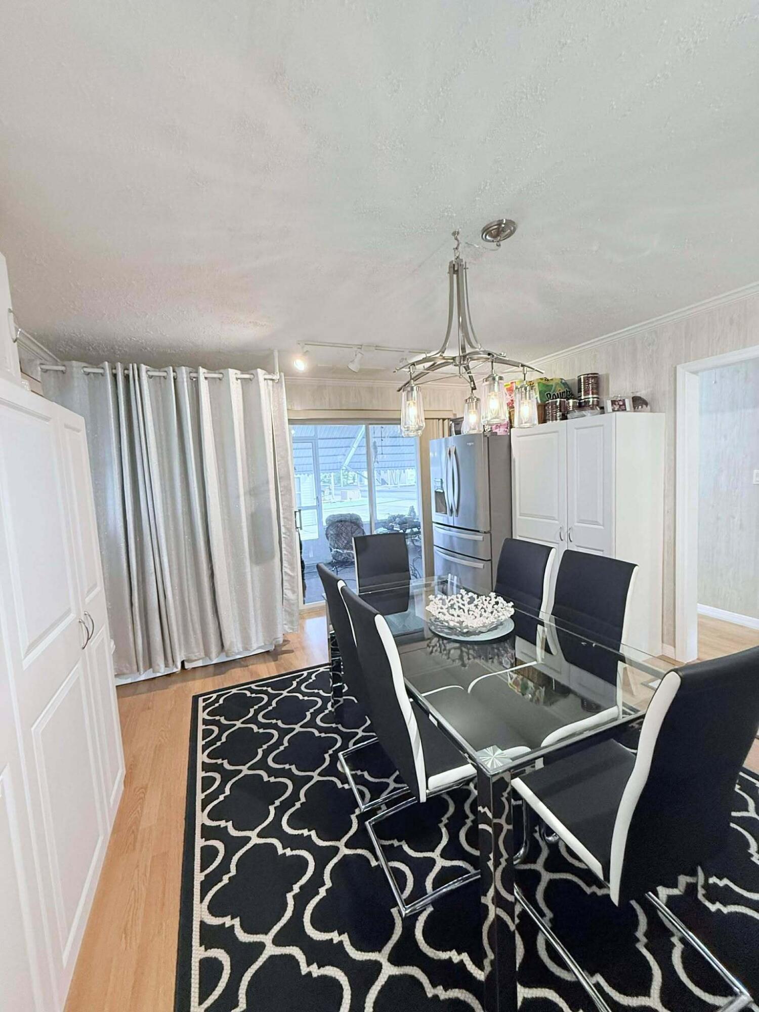 12321 Southeast 138th Avenue, Unit 216 Okeechobee, FL 34974 - Photo 6 of 34 a view of a dining room with furniture