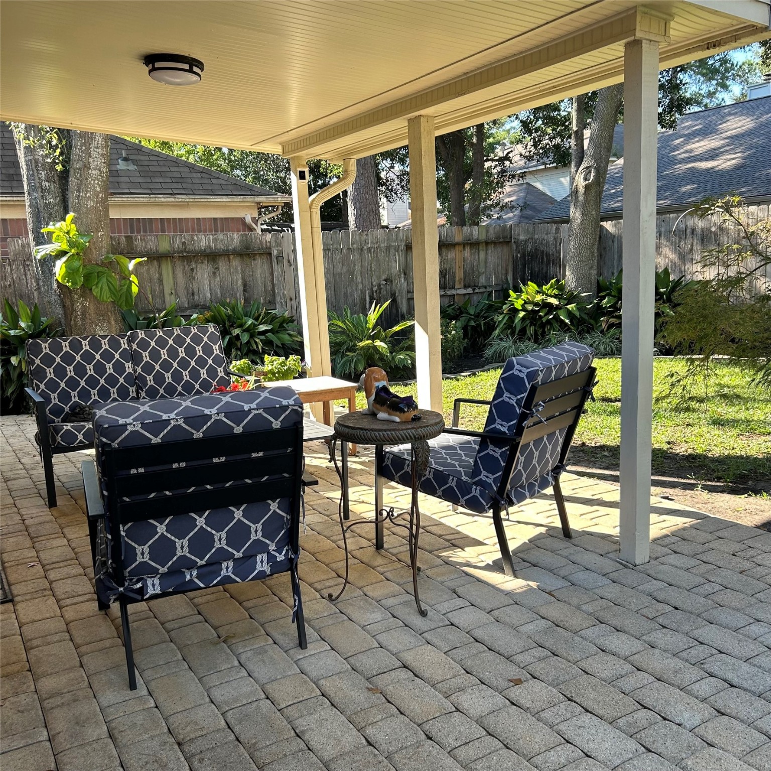 8910 Driftstone Drive Spring, TX 77379 - Photo 17 of 20 a building outdoor space with patio furniture and potted plants