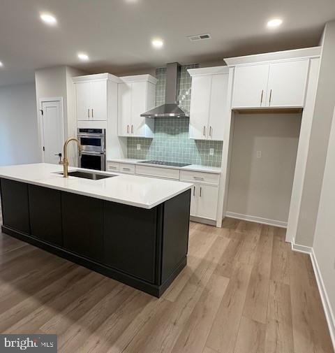 20 Grayson Lane Downingtown, PA 19335 - Photo 5 of 29 a kitchen with kitchen island a sink a stove a refrigerator and white cabinets
