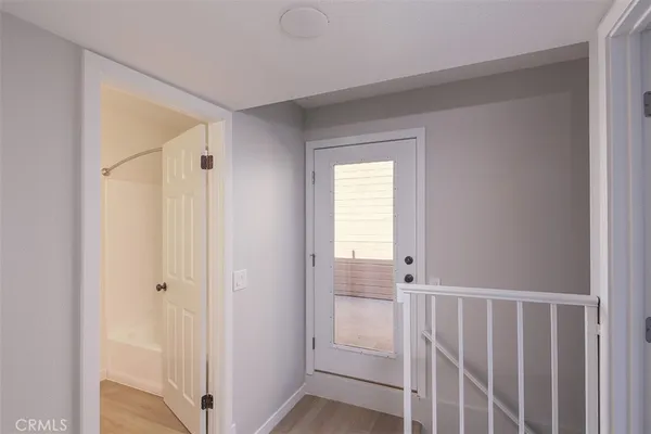 a view of a bathroom from a hallway