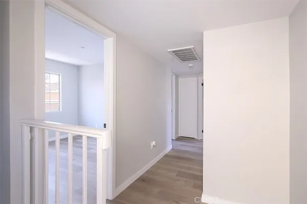 a view of a hallway with windows