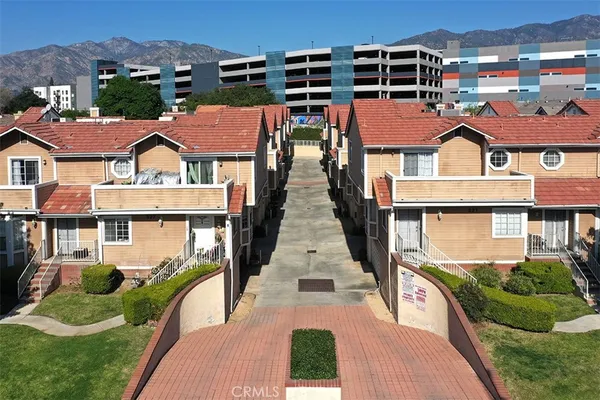 a front view of a house with yard and green space