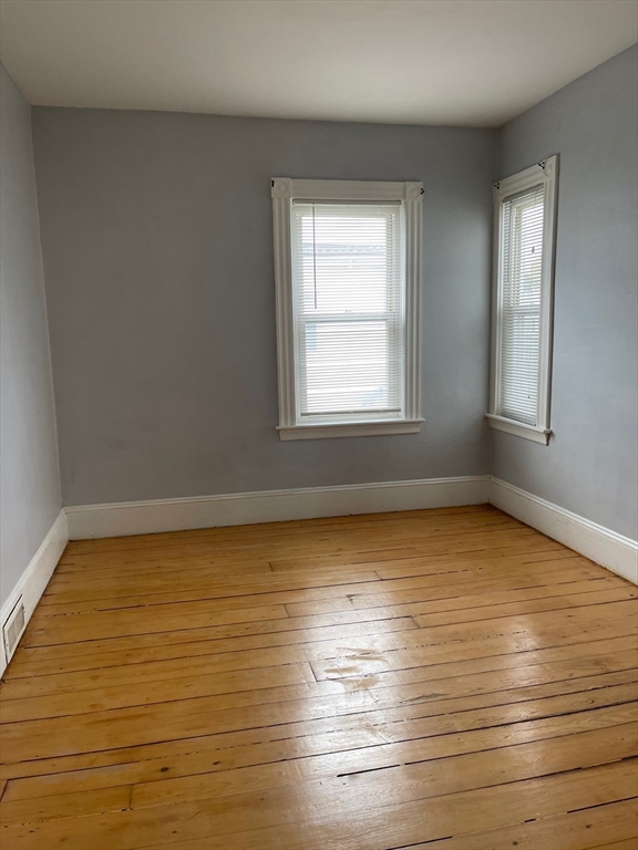 48 Hodges Avenue, Unit 2 Taunton, MA 02780 - Photo 5 of 11 a view of a room with wooden floor and window